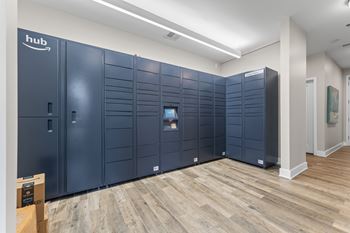 A row of dark blue storage units with the word "hub" on the doors.